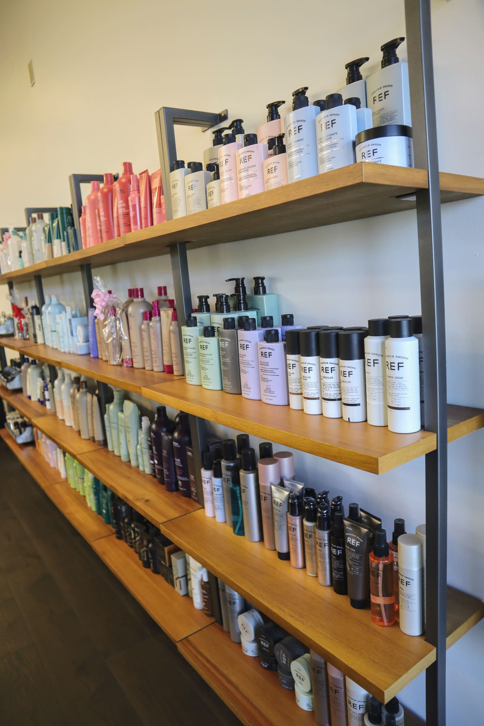 Shelves of professional haircare products for sale at Salon Marie